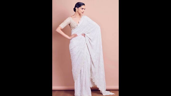 8. Deepika Padukone Stunned in a Chikankari saree that she paired with a hand embroidered blouse. The saree had scalloped edges that gave the actress a unique look. She accessorised her ethnic look with minimal accessories that added a regal charm. (Image Source: Instagram/@shaleenanathani)