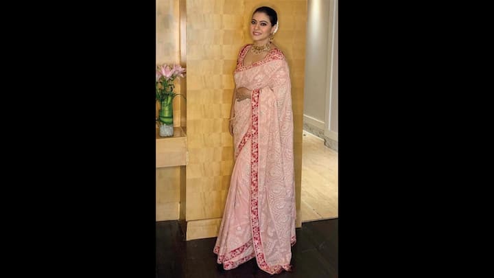 5. Kajol: Kajol's pastel peach Chikankari saree radiated a timeless charm. She paired her saree with a gara embroidered blouse that was embellished with crystals. The saree had intricate hand embroidery and a contrasting red floral border. The actress completed her look with statement jewellery that beautifully blended traditional aesthetics with grace. (Image Source: Facebook/Tarun Tahiliani)