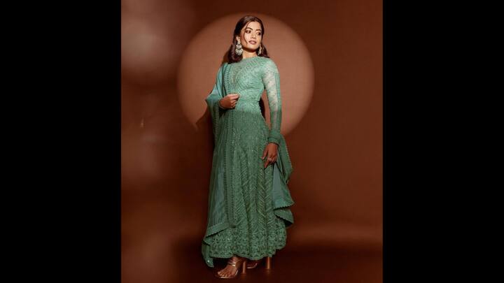 7. Rashmika Mandanna: Rashmika Mandanna wore a teal coloured heavily embroidered Anarkali. The outfit featured sheer sleeves that added a modern touch to Rashmika. She completed her outfit with golden high heels and matching statement earrings for a charming look. (Image Source: Instagram/@rashmika_mandanna)