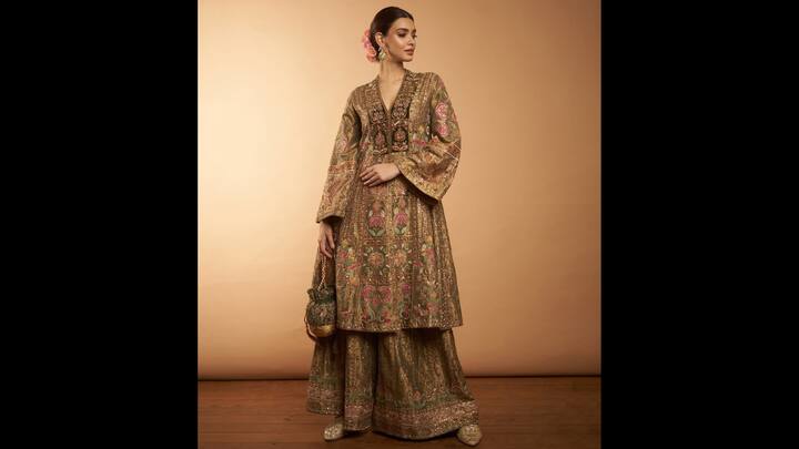 8. Diana Penty: Diana Penty wore a rich and luxurious outfit that featured floral embroidery with major hints of pink and green colours. The actress's flowy outfit featured a deep V neckline and bell sleeves that added a modern touch to the traditional outfit. The actress completed her look with matching accessories and a potli bag that's ideal for festive pujas and celebrations. (Image Source: Instagram/@dianapenty)