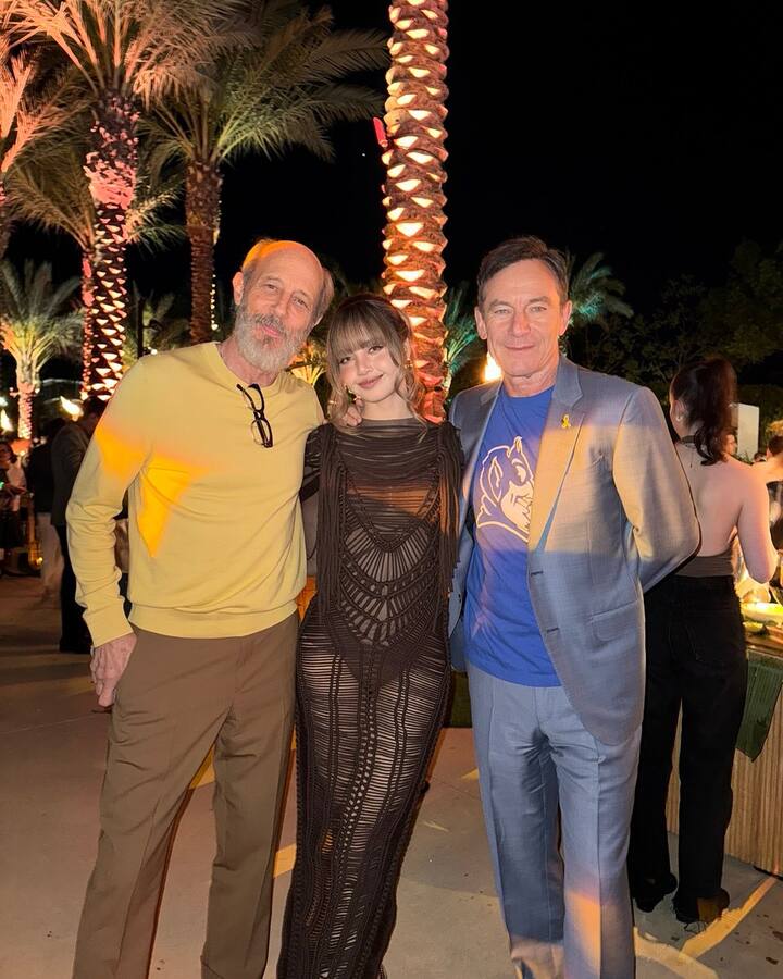 She wore a sleek black dress that matched the show's luxurious resort aesthetic.