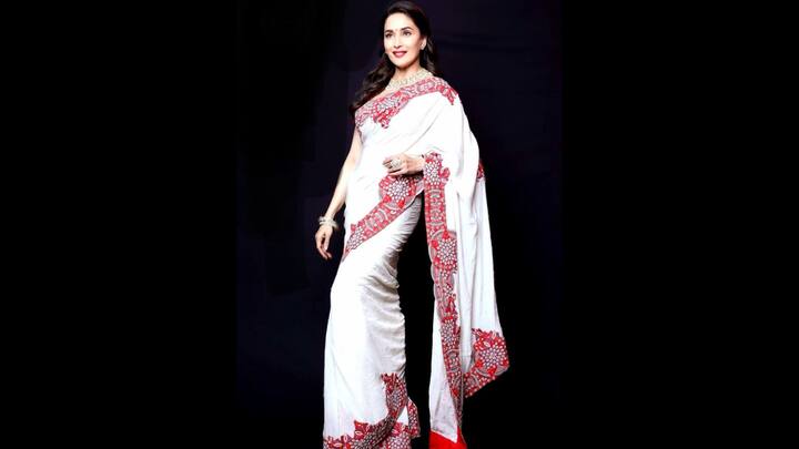 3. Madhuri Dixit: Madhuri Dixit's saree gave a regal charm.The actress's pure white saree had stunning floral red embroidery along the borders. Her statement necklace balanced tradition with glamour, making it a standout choice for Pohela Boishakh festivities. (Image Source: Pinterest/Ri3N05)
