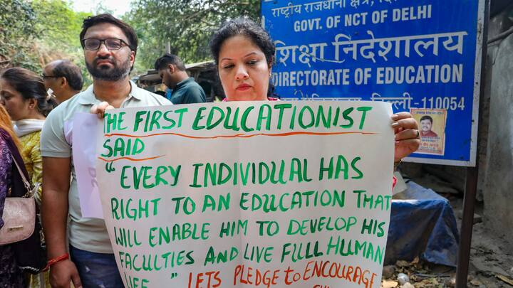 Carrying placards and slogans, parents were seen demonstrating outside the office of the Directorate of Education, claiming that the fee hikes were enforced without notification and approval. (Image Source: PTI)