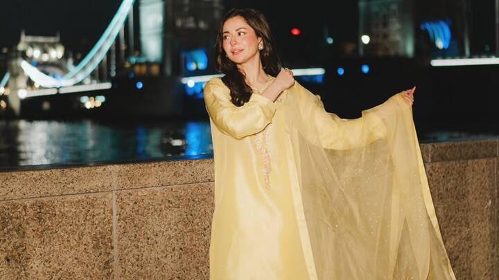 This yellow satin suit, decorated with silver and gold embellishments, holds festive charm. Simple gold accessories and soft makeup complete the radiant traditional look. (Image Source: Instagram/ haniaheheofficial)