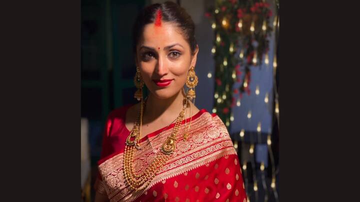 Yami's regal red bridal saree is rich, bold, and traditional; an utterly breathtaking look for any bride to be or for the traditional celebration.  (Image Source: Instagram/ yamigautam)