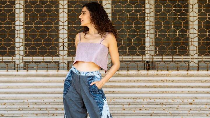 Paired with dual-tone relaxed denim lowers, Taapsee wears a shimmer-strapped crop top. A really cool, offbeat summer dressing with a trendy spin. (Image Source: Instagram/ tapseepanuu)