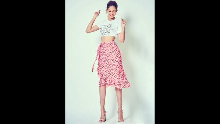 8. Ananya Panday: Ananya Panday served a cute Y2K fashion moment. She wore a cropped baby tee with a heart print wrap around skirt. The actress opted for no jewellery and statement heels that gave her a unique and charming look. (Image Source: Pinterest/queentung)
