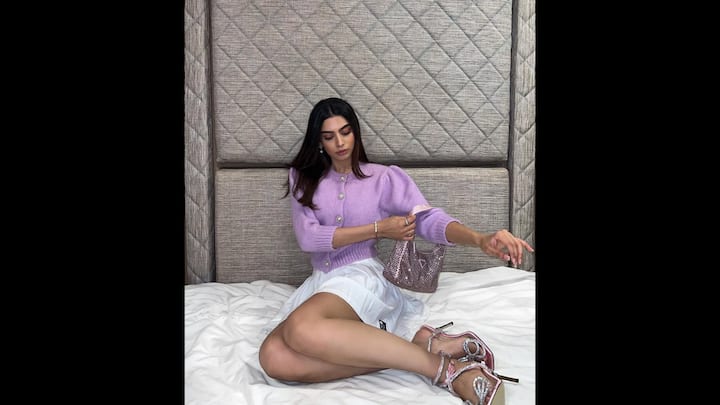 2. Khushi Kapoor: Khushi Kapoor's Y2K inspired look exuded a soft glam. She wore a lavender knit cardigan and paired it with a pleated mini skirt. The actress completed her look with rhinestone heels and a glitter mini bag that added a nostalgic edge. (Image Source: Instagram/@khushikapoor)