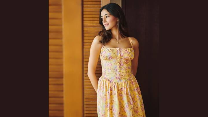 Ananya Panday awakens floral charm in this yellow dress decorated with pink prints and button detailing. A fitted bodice and subtle flare below the waist create an easy yet stylish outfit for warm days. (Image Source: Instagram/ ananyapanday)