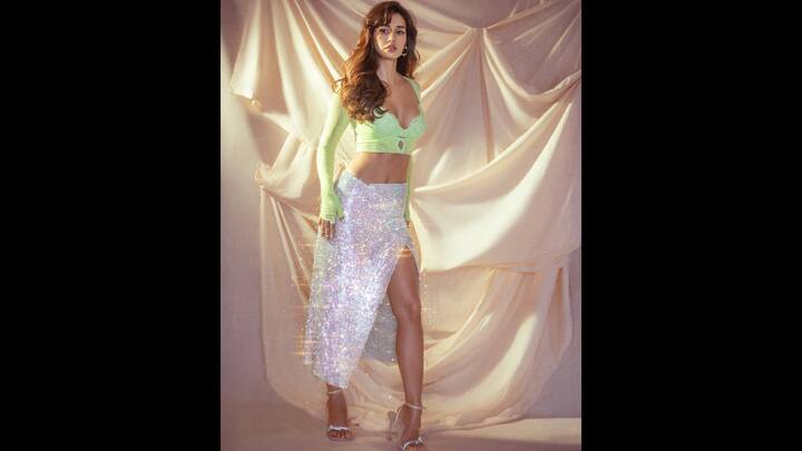 7. Disha Patani: Disha Patani wore a neon green lace to with a high slit holographic sequin skirt. The glamorous look gave the actress the early 2000s pop diva vibes. She completed her shimmery look with matching heels that enhanced her vibe. (Image Source: Instagram/@dishapatani)
