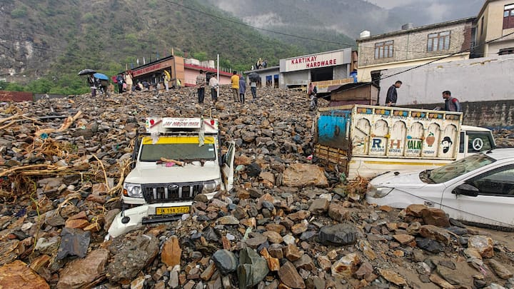 Several vehicles were buried under the debris, and numerous houses and shops were damaged or washed away due to the flash floods and cloudburst in multiple locations of Ramban. (Image Source: PTI)