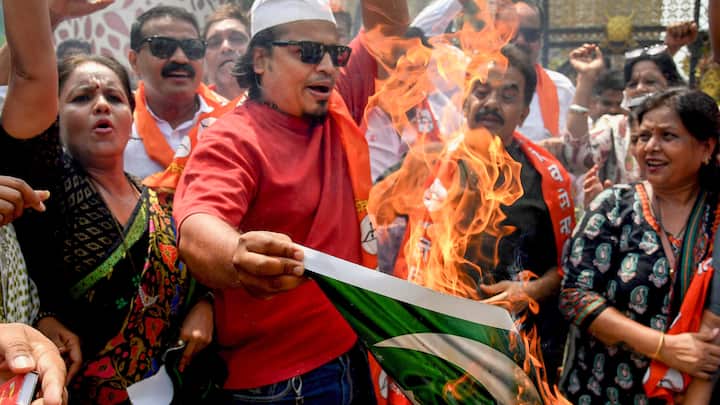 Shiv Sena activists in Mumbai burned a printout depicting the Pakistani flag during a protest against the Pahalgam terror attack. (Image Source: PTI)
