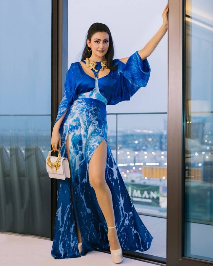 The gown featured a thigh-high slit that added drama and sensuality to the otherwise fluid silhouette, while the cut-out detail at the neckline offered a dash of modernity and edge.The fabric draped like silk, hugging her waist and flaring out gracefully, striking the perfect balance between structured couture and breezy elegance.