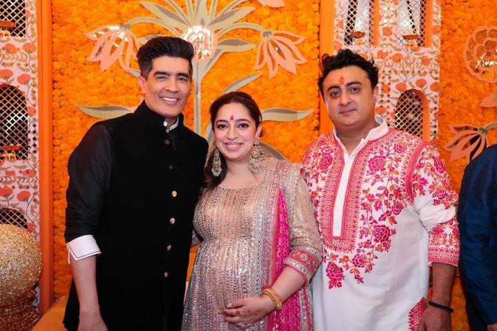 मनीष मल्होत्रा के लुक की बात करें तो उन्होंने ब्लैक एंड व्हाइट आउटफिट पहना था. वो निधि के साथ पोज देते हुए नजर आए.