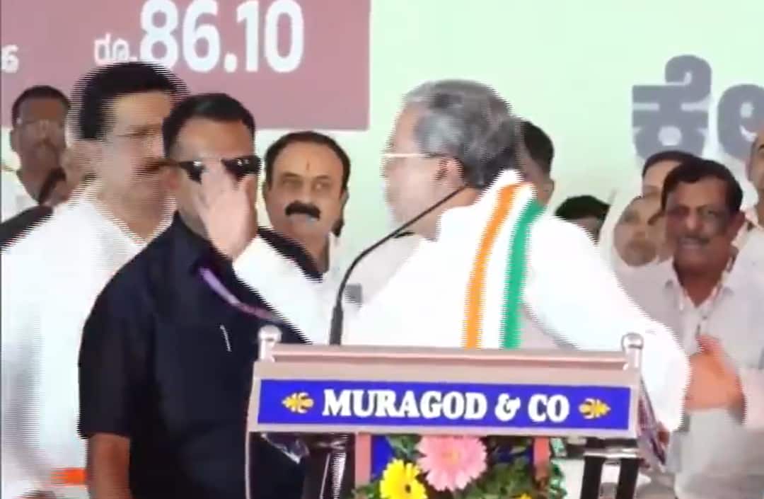 Karnataka CM Siddaramaiah nearly slapped ASP Narayan Bharamani during a public rally in Belagavi Karnataka CM Siddaramaiah Loses Cool, Nearly Slaps Police Officer During Rally In Belagavi—On Cam