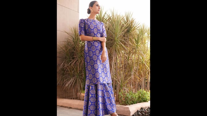 5. Royal Suit Set: The rich purple outfit worn by Vaani Kapoor has intricate golden motifs that elevated her look. Her structured long kurta was paired with sharara pants that offered a graceful fusion of modernity and tradition. The actress opted for light light earrings and a cuff bracelet for a minimal look. (Image Source: Instagram/@vaanikapoor)
