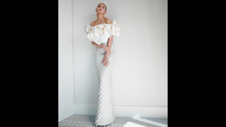 6. Floral Sculpted Gown: Anushka Sharma wore an off shoulder gown that had dramatic and 3D floral detailing. Her outfit also consisted of delicate beadwork. The body hugging, floor length gown radiated modern glamour and sophistication. (Image Source: Instagram/@anushkasharma)