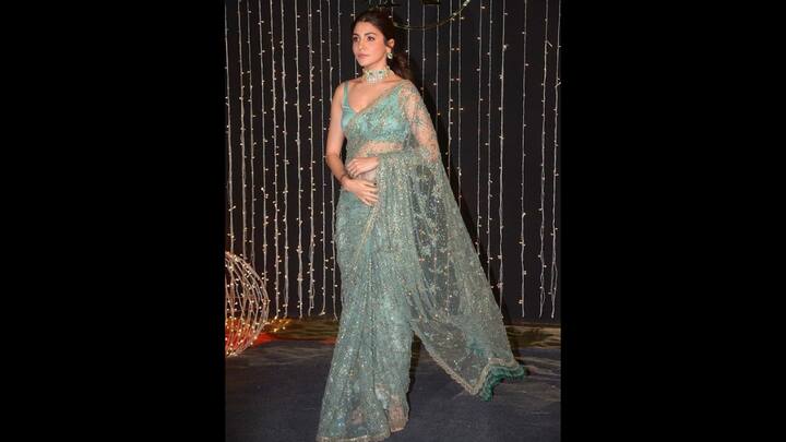 5. Sparkling Sea Green Saree: The glittering saree worn by Anushka Sharma had sequin detailing and delicate embroidery work. She paired her delicate and sheer saree with a sleeveless blouse of matching colour. The actress completed her look with heels and matching statement jewellery for a statement look. (Image Source: Twitter/@sleepyxoxoheads)