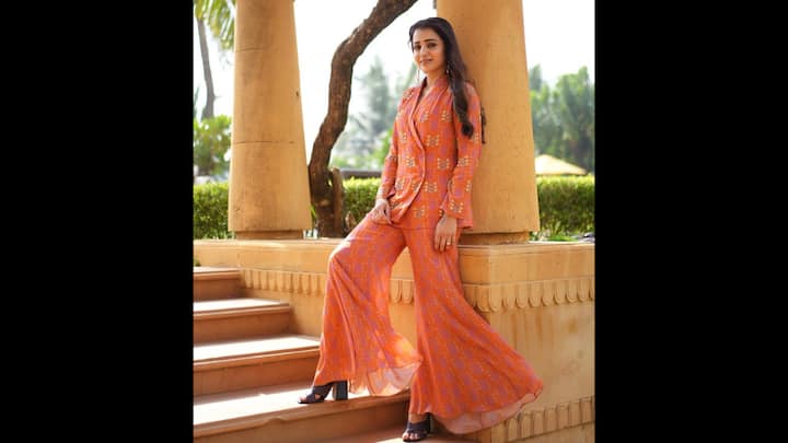 7. Printed Co-Ord Set: Trisha Krishnan radiated in a vibrant co-ord set that featured a floral printed blazer and wide legged pants. The lightweight and flowy fabric of the fit gave a relaxed look. The actress efforlessly blended comfort with chic for a stylish look. (Image Source: Instagram/@trishakrishnan)