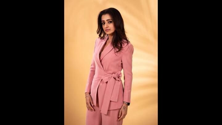 6. Pink Pantsuit: The blush pink pantsuit worn by Trisha Krishnan exuded modern elegance. The wrap style blazer and a beautiful waist detailing that added femininity to the power look. The actress kept her look simple with minimal accessories that created a sophisticated vibe. (Image Source: Instagram/@trishakrishnan)