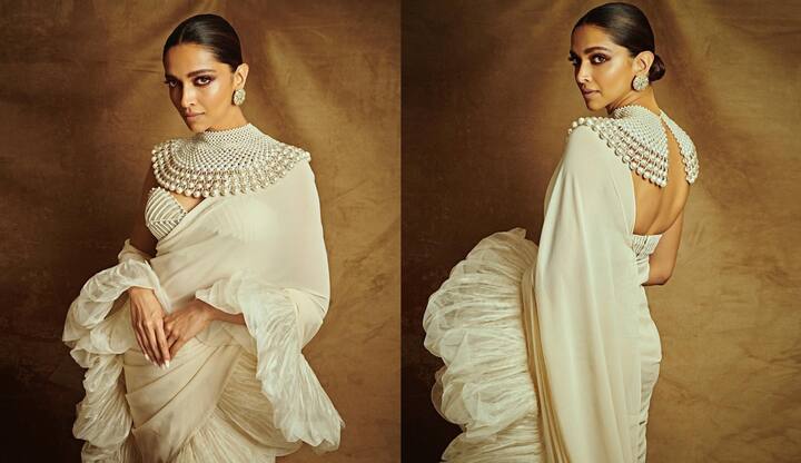 दीपिका पादुकोण का ये ब्लाउज डिजाइन कॉपी करके आप हर किसी को हैरान कर सकती हैं. ऑफ शोल्डर ब्लाउज के साथ इस तरह की पर्ल केप आपको यूनिक लुक देगी.