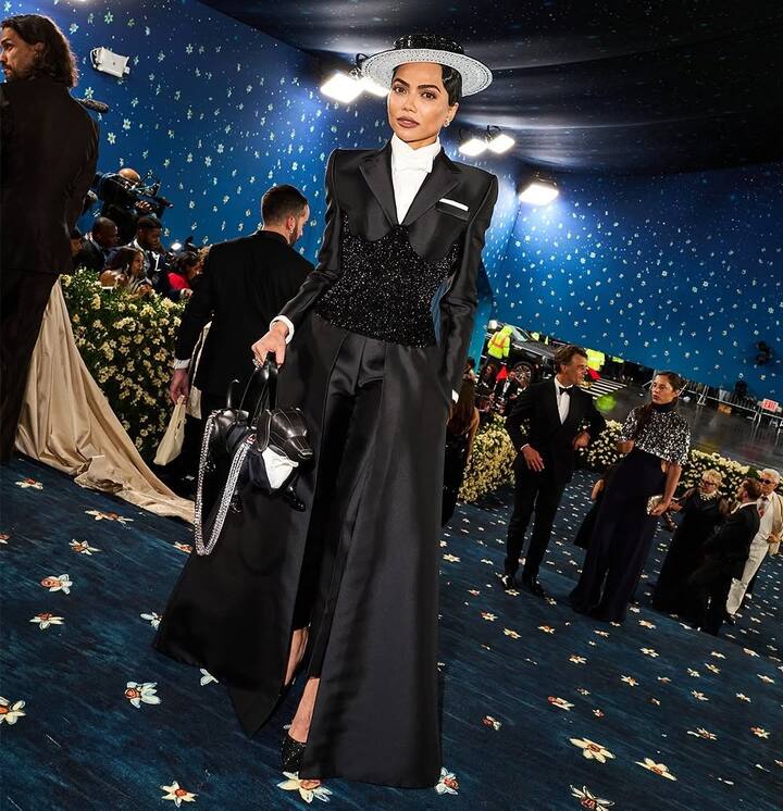 Entrepreneur Mona Patel turned heads in Thom Browne, arriving with Vector, a diamond-leashed robotic dog by MIT. (Instagram/vogueindia)