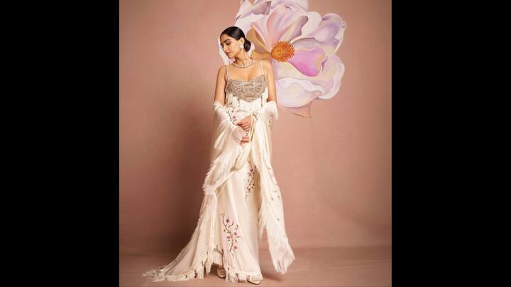 6. Silk Floor Length Gown: The flowy and delicate gown that Sonam Kapoor wore had stunning floral prints and fringed accents on it. The bodice of the dress was heavily embellished that added opulence. The pastel tones made the outfit elegant and sophisticated. (Image Source: Instagram/@sonamkapoor)