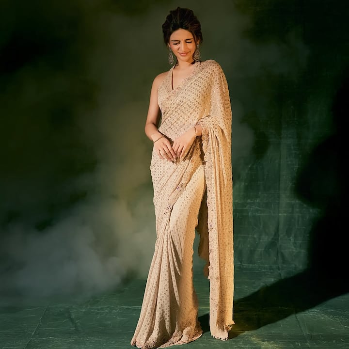 Sreeleela wore an embellished ivory saree from Dolly J, worth Rs 1,80,000.