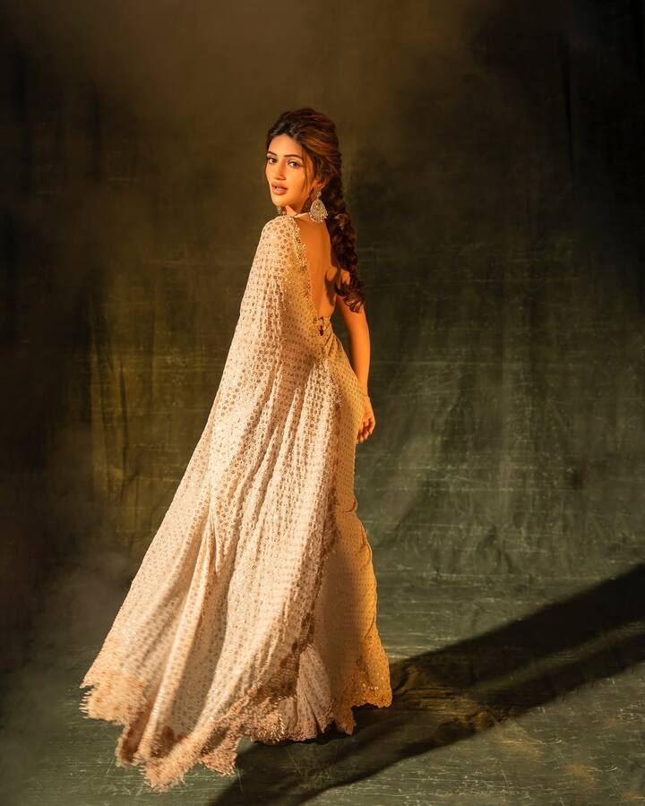 The saree dazzled with silver embellishments and dotted-floral motifs, each sequin catching the light perfectly.