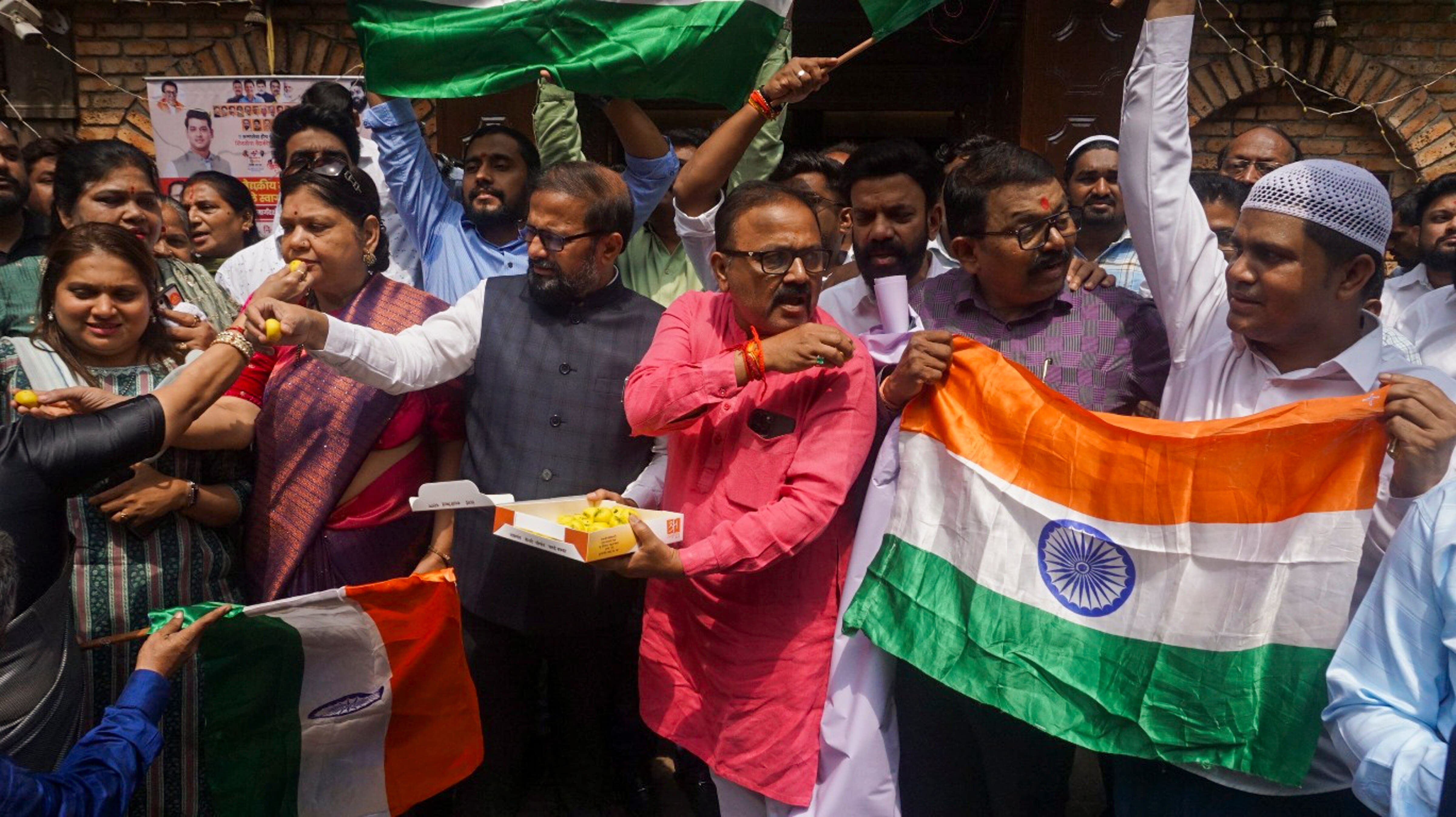 Shiv Sena (Shinde) workers celebrate Indian armed forces' missile strikes on terror targets in Pakistan and Pakistan-administered Kashmir, in Thane.