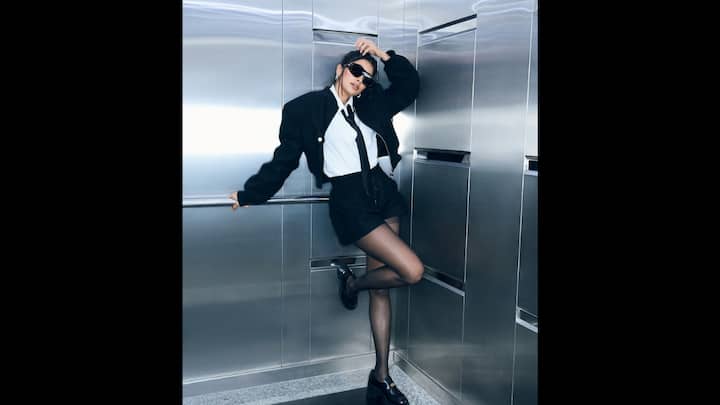 8. Black Co-Ord Set: Pooja Hegde embraced a monochromatic co-ord set that she paired with a plain white top. Her outfit featured a white shirt, tie, sunglasses. and  a cropped jacket. The actress elevated her look with chunky loafers and statement sunglasses. (Image Source: Instagram/@hegdepooja)