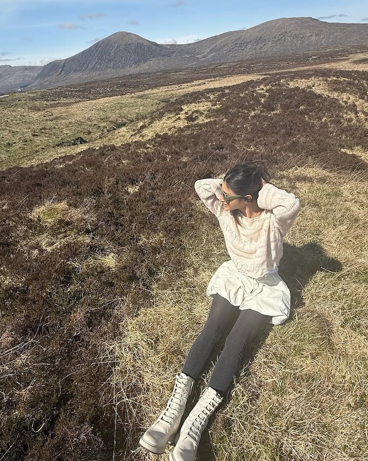 For her Ben Nevis outing, she wore a fitted white top with a matching balloon-style skirt.