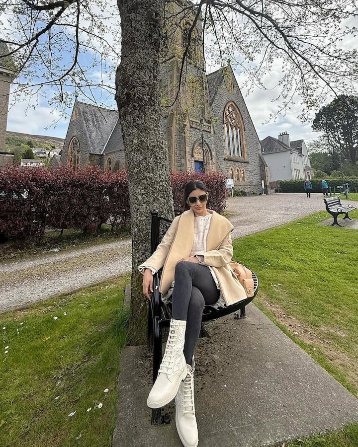 Her footwear of choice was rugged white lace-up boots—stylish and practical.
