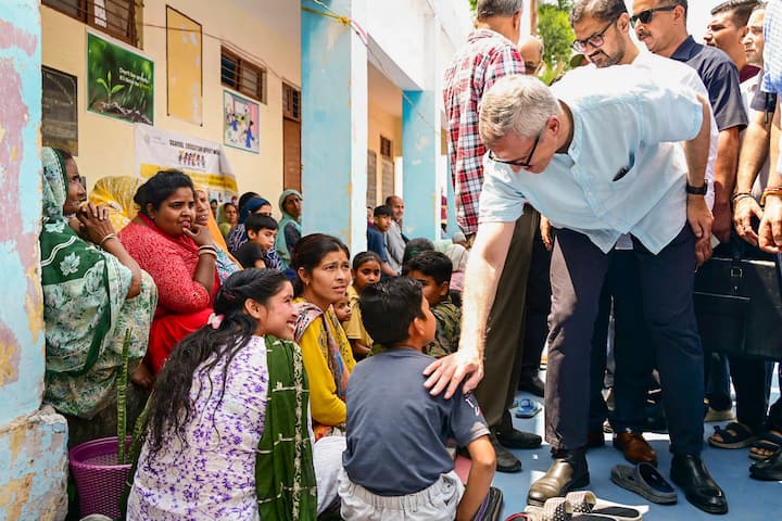 Jammu and Kashmir Chief Minister Omar Abdullah meets displaced border residents sheltered at Sahib Bandgi Ashram Mishriwala, amid the ongoing military conflict between India and Pakistan, in Jammu. (Image Source: PTI)