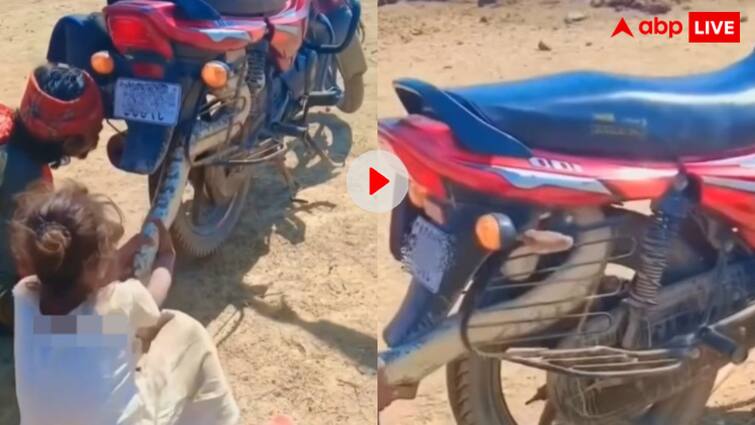 बाइक के पहिए में छिपा था आदमखोर दरिंदा! लोगों ने जान की बाजी लगाकर बाहर खींचा, डरा रहा वीडियो Dangerous python got stuck in the bike then the person caught it with great difficulty and pulled it out video viral बाइक के पहिए में छिपा था आदमखोर दरिंदा! लोगों ने जान की बाजी लगाकर बाहर खींचा, डरा रहा वीडियो