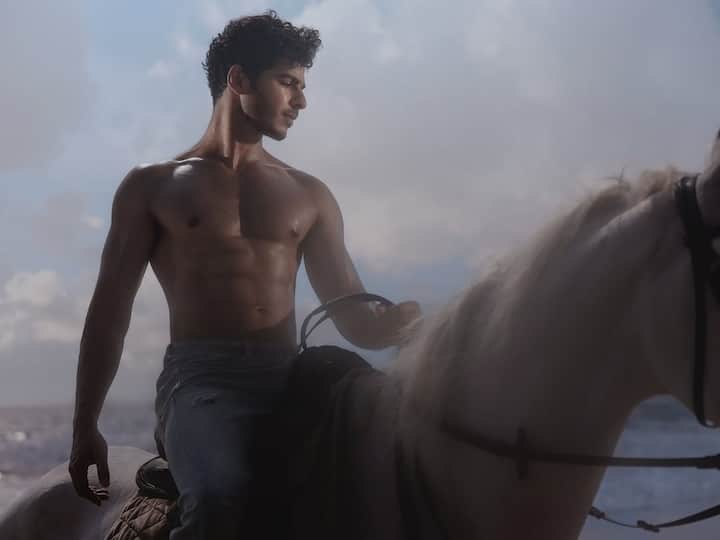 There’s something undeniably sexy about the simplicity of Ishaan’s styling. The distressed, slightly faded blue jeans hug him in all the right places, adding to the casual coolness of the otherwise high-drama setting.