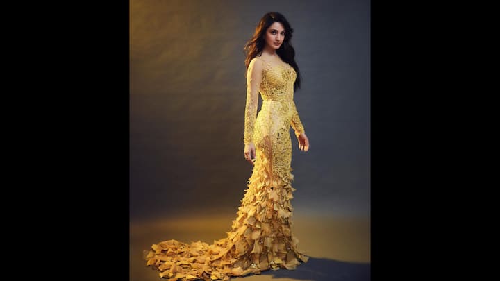 8. Yellow Statement Look: Kiara Advani stunned in a figure hugging gown which was adorned with intricate embroidery and  cascading 3D floral appliques. The sheer full sleeves and dramatic train added ethereal grace to the outfit, making Kiara look glamorous and graceful. (Image Source: Instagram/@kiaraaliaadvani)