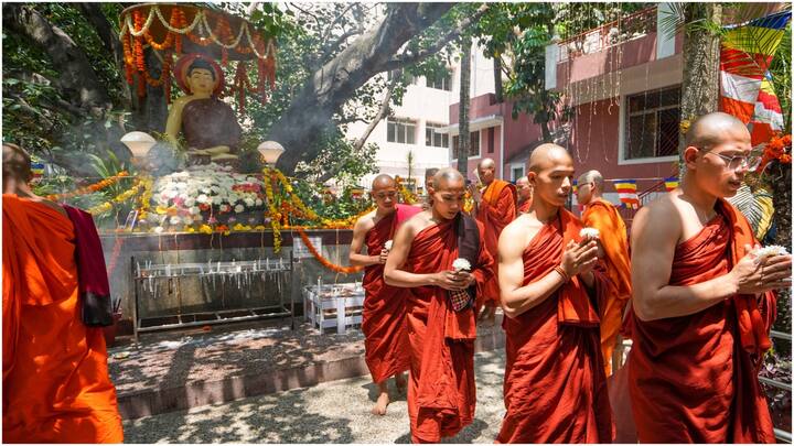 Amid serene chants in a monastery in Bengaluru, devotees offered prayers, seeking Lord Buddha's blessings. (Image Source: PTI)
