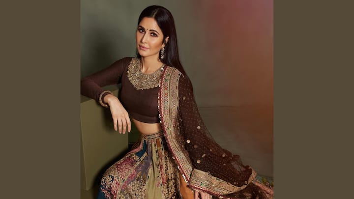 Great for sangeet or evening functions, this green floral lehenga paired with a dark maroon embroidered choli gives off an elegant festive feel. The loose hair would accentuate the easy vibe. (Image Source: Instagram/ katrinakaif)
