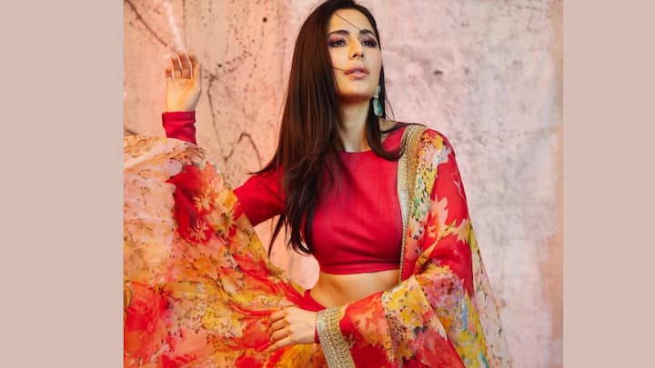 This red floral lehenga paired with an equally embellished blouse is a modern fashion statement for both wedding guests and bridesmaids. Certainly, it has an equal touch of bold. (Image Source: Instagram/ katrinakaif)