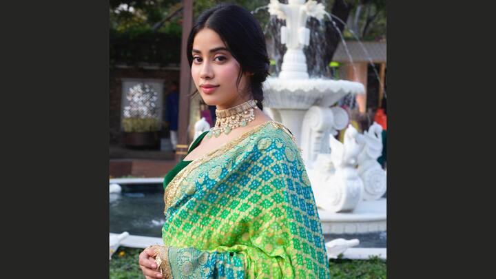 Janhvi Kapoor wore this blue-green ombre saree bearing fine golden Bandhani prints. She wore it with a choker and a soft pink lipstick, exuding an understated elegance and making the ensemble really pop. (Image Source: Instagram/ janhvikapoor)