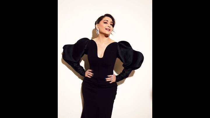 2. Bold Black Looks: Madhuri Dixit stunned in a sleek black gown that had dramatic puffed sleeves and a plunging neckline. The Western outfit gave her a bold look that she paired with statement silver rings and earrings, blending confidence and glamour. (Image Source: Instagram/@madhuridixitnene)