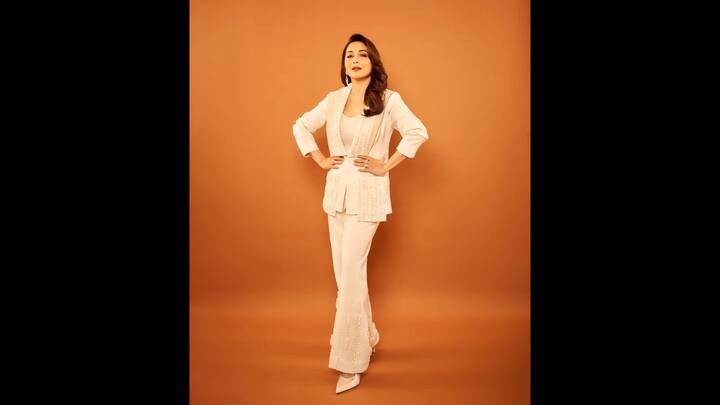 7. White Co-Ord Set: Madhuri Dixit served an effortless look in a white co-ord set. She wore a textured blazer and straight fit pants that gave her a stylish look. She paired her look with pointed white heels that blended sophistication and modern charm. (Image Source: Instagram/@madhuridixitnene)