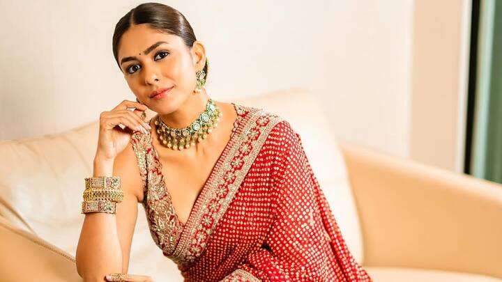 Mrunal wore this red saree with golden embellishments and a sequin border. Pairing the look with a kundan choker and golden bangles blends classic charm with subtle glint. (Image Source: Instagram/ mrunalthakur)