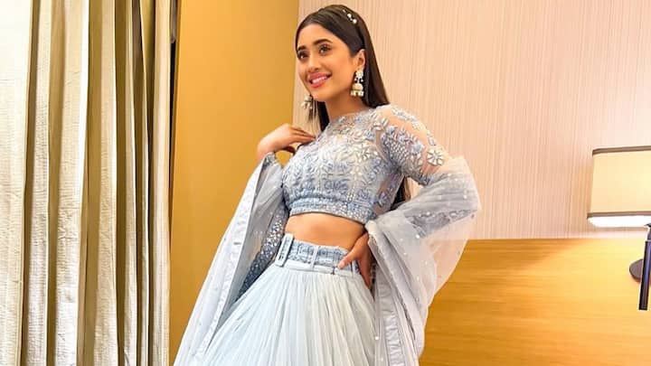 A fairytale-like beauty, Shivangi is entrancing in this pastel blue lehenga with delicate layers and detailed work. The outfit is making her look like a princess from the modern era. (Image Source: Instagram/ shivangijoshi18)