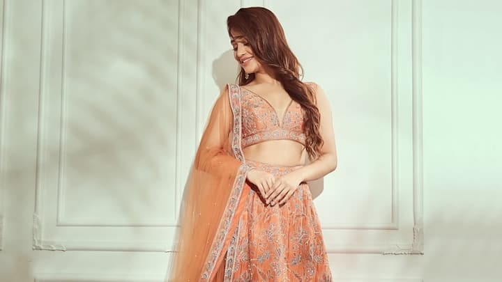 Shivangi exudes a dreamy look in this peach lehenga with delicate floral prints. The soft colour and minimalistic style lend a fresh, romantic, and poised look to her. (Image Source: Instagram/ shivangijoshi18)