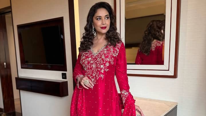 This red sharara suit with Dupatta was perfect in Madhuri as it suits wedding-style celebrations and auspicious features such as VAT Savitri Vrat. Her bold red lips and statement jewelry add drama to the traditional charm. (Image source: Instagram/Madhuridixitnene)