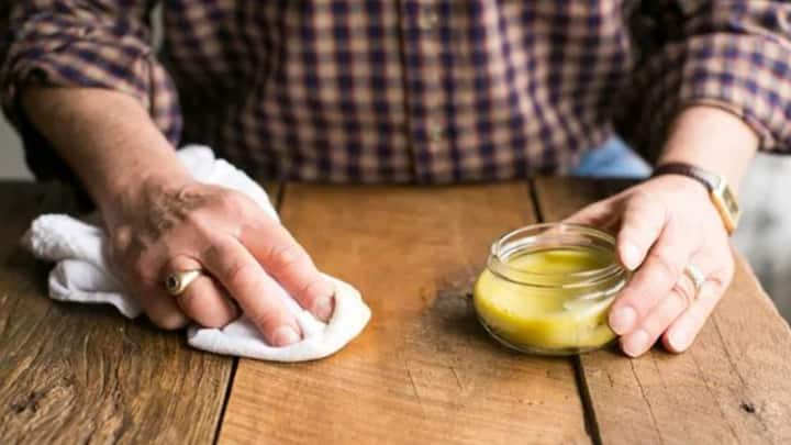 3. Beeswax Furniture Polish: This natural polish is an effective way to restore shine, protect woods, and bring out the furniture's beauty. Beeswax can be mixed with olive oil or mineral to create this polish. It adds a water-resistant layer and prevents drying. This polish is non-toxic, eco-friendly, and can be used around kids and pets. (Image Source: Pinterest/ehow)