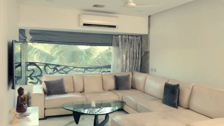 On the other hand, there is a big couch and a glass table right in front of the window to take a great vibe. Which is perfect to sit with his friends and relatives.