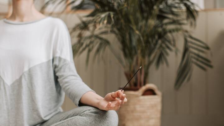 Set a Time and a Place: If mornings are not really your thing, go for a time and place that feels true to you. Meditating at the same time and location daily builds a routine that helps signal to your mind that it is time to relax and focus on something.  (Image Source: Canva)